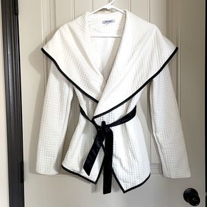 White long sleeve wrap with leather trim and belt